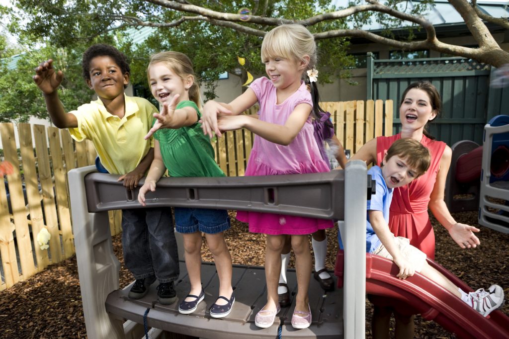 Children playing on a backyard home playground