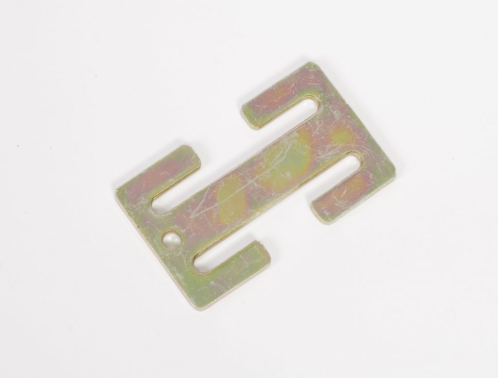 Close-up of a metal “H-shaped” bar known as the locking clip