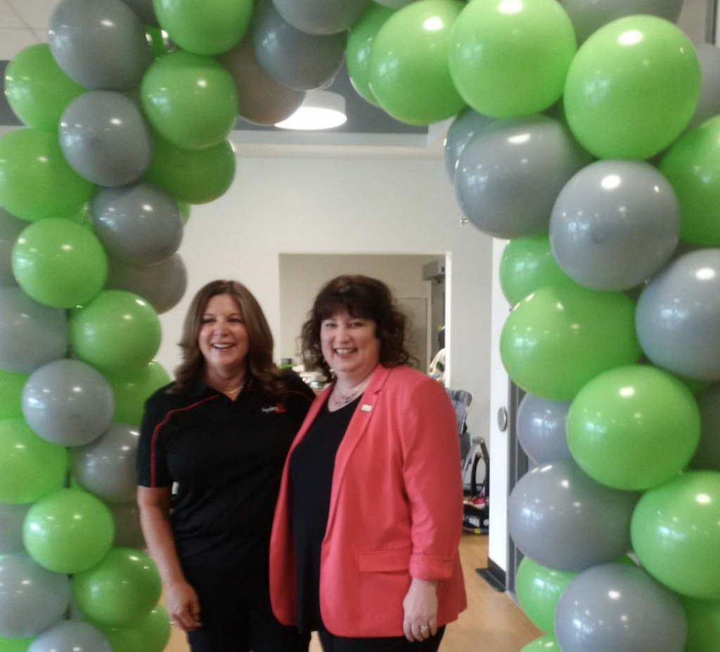 Lisa Williamson and Pamela Fuselli in front of balloons